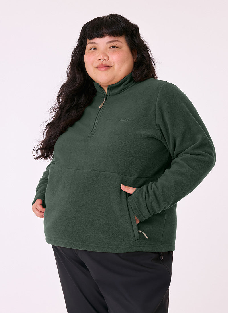 Woman wearing the Sugarloaf Fleece in Pine Green